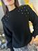 Maglia  nera con spalline e con strass sulle spalle